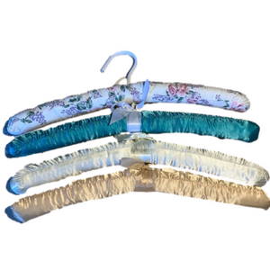 Four fabric covered hangers
